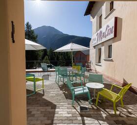 The Garni Hotel Chesa Mulin is peacefully yet centrally located in the village of Pontresina.